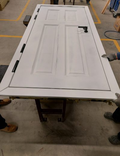 assembly of Munitus security doors with panels prepared for painting
