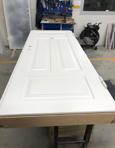 Munitus security door with MF milling panels and oak thershold